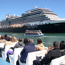 Las Golondrinas tour passing in front of a cruise ship Las Golondrinas tour passing in front of a cruise ship